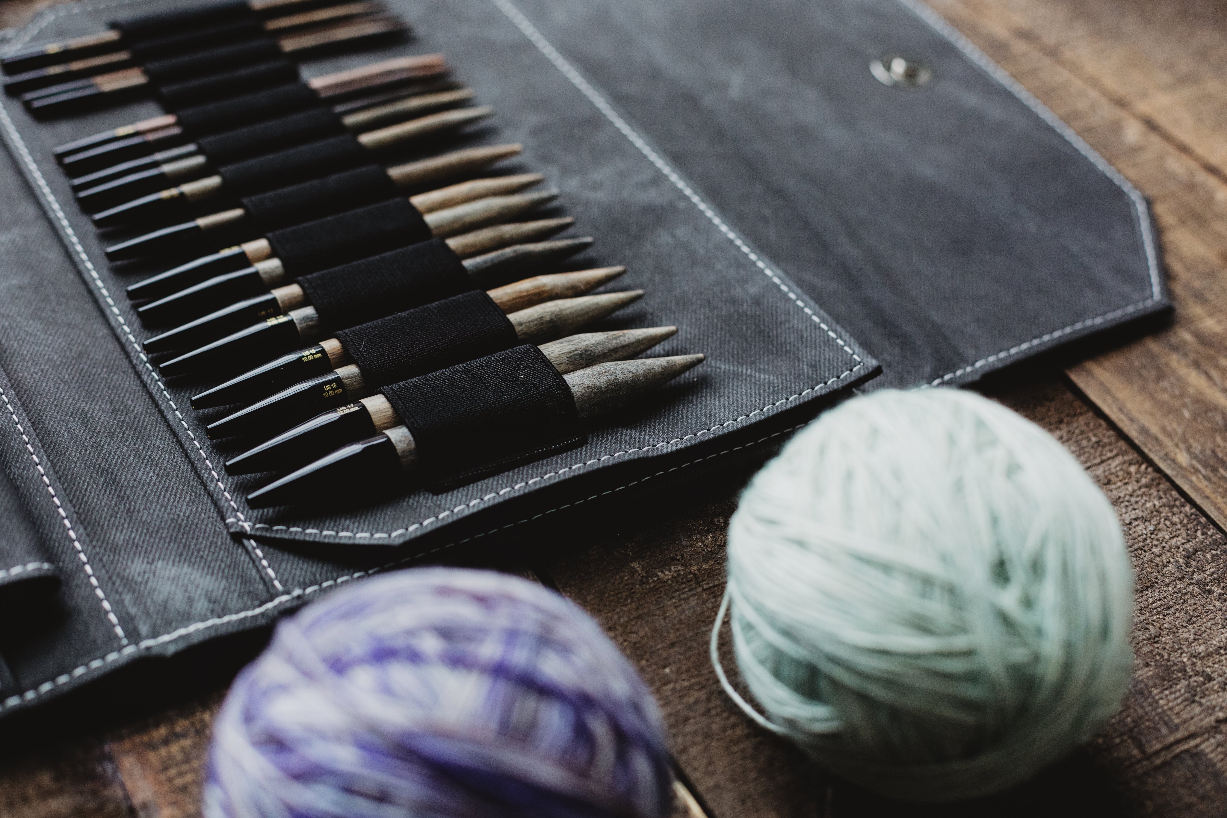 knitting-needles-and-yarn-on-a-wooden-table.jpg